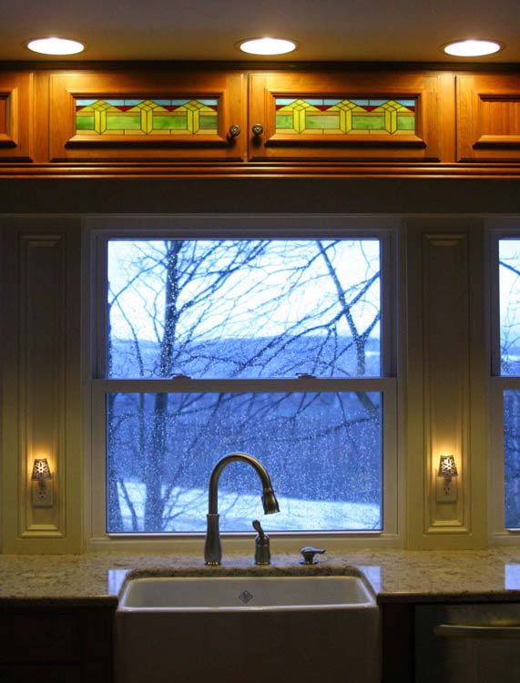 Stained glass mosaic cabinets created for a dairy farm in Pennsylvania.  Design inspired by existing antique stained glass window, and glass from cow backsplash.